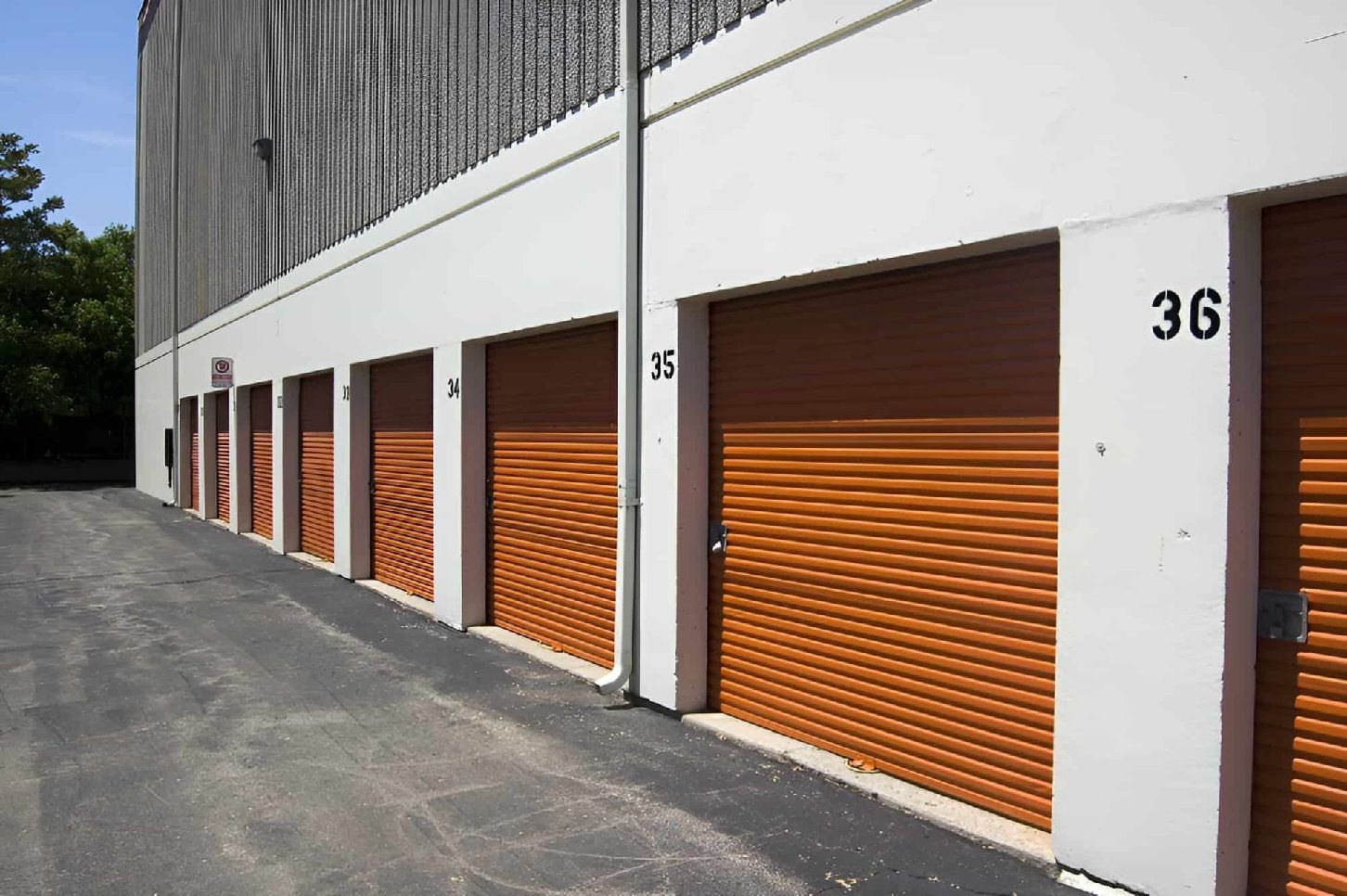 Row Of Compact Self-Storage Units With Roll-Up Doors