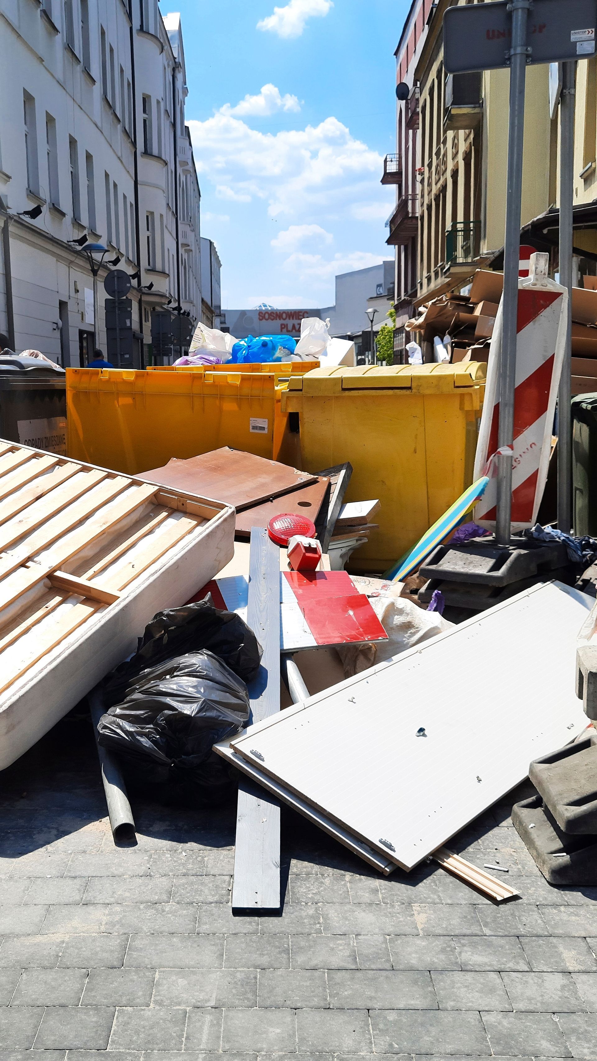 There is a large pile of trash on the ground.
