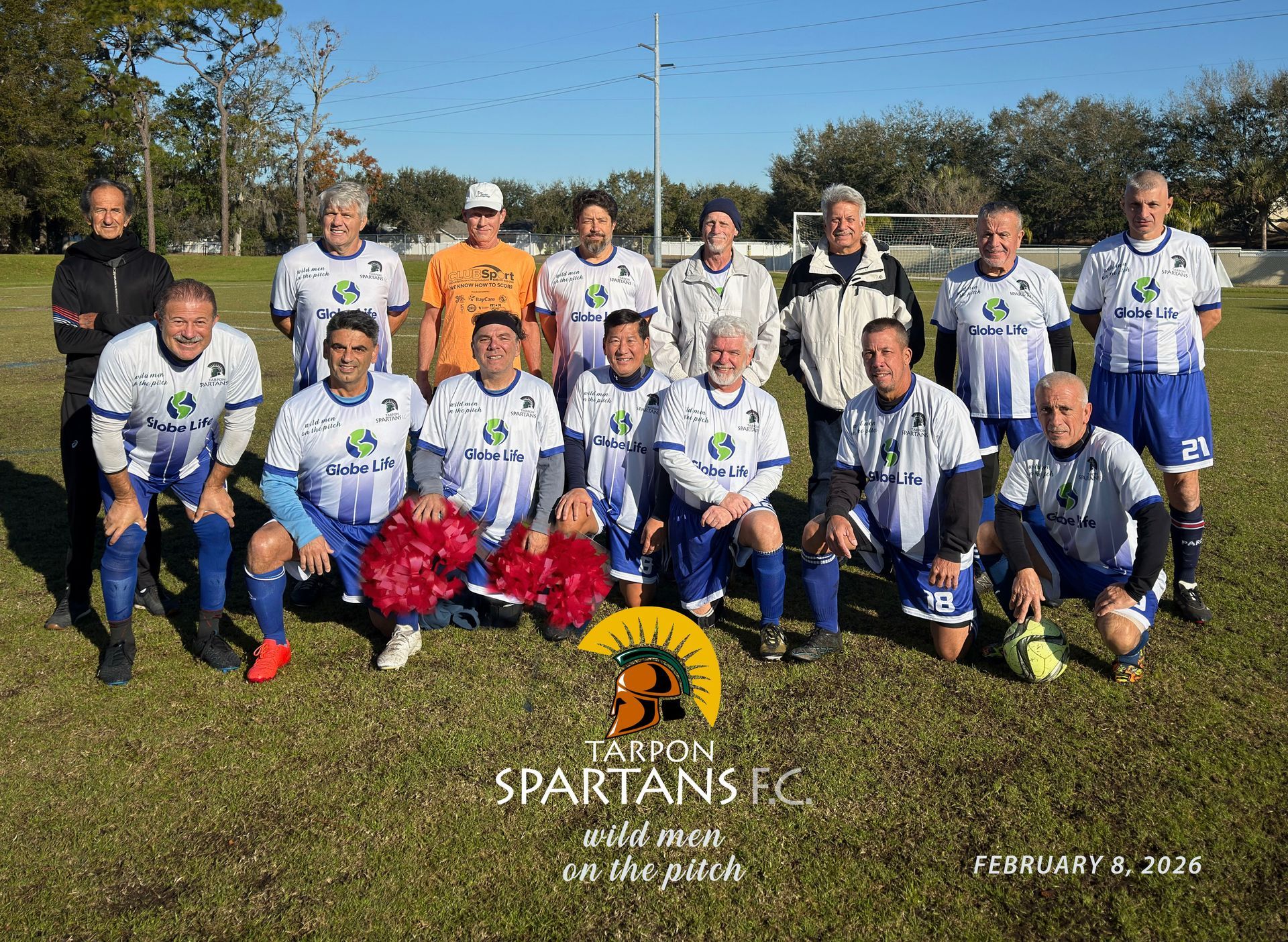 A soccer team, the Tarpon Spartans FC, poses on a field in matching blue and white uniforms on February 9, 2020.