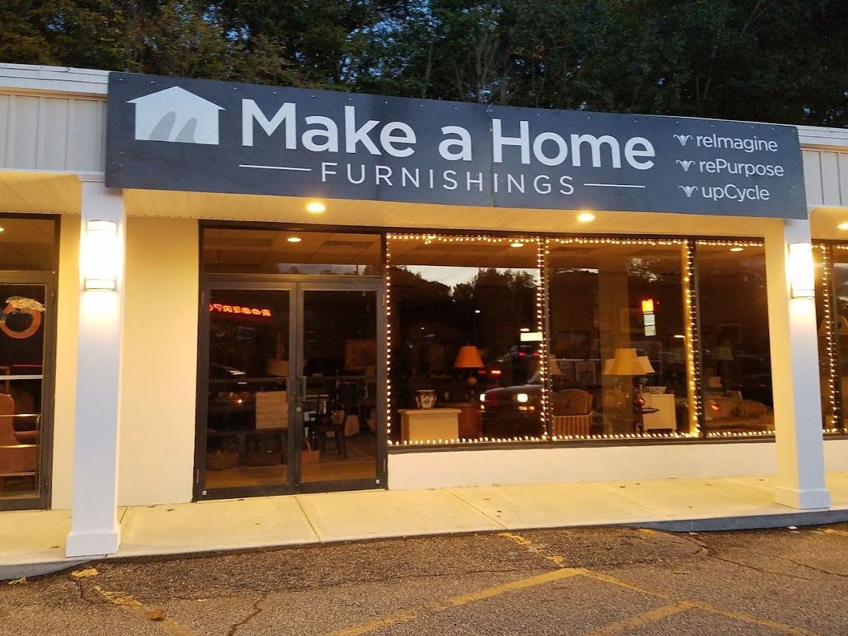 A store front with a sign that says make a home
