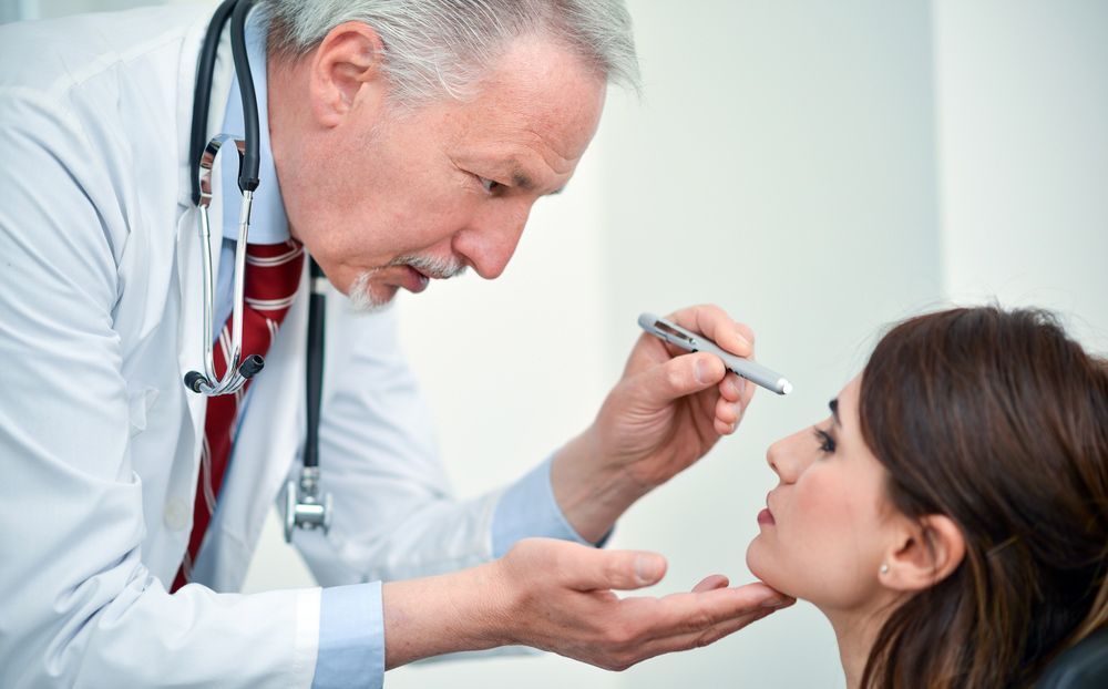 Doctor Examining The Eyes Of A Patient