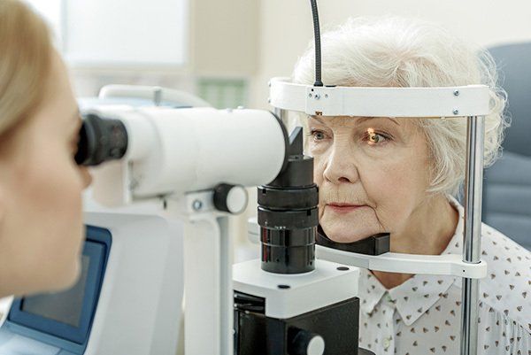 Elder Woman Having Eye Check Up — Your Ophthalmologist in Townsville, QLD