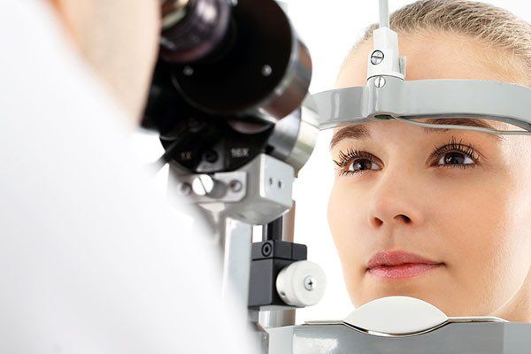 Woman Taking Eye Exam — Your Ophthalmologist in Townsville, QLD