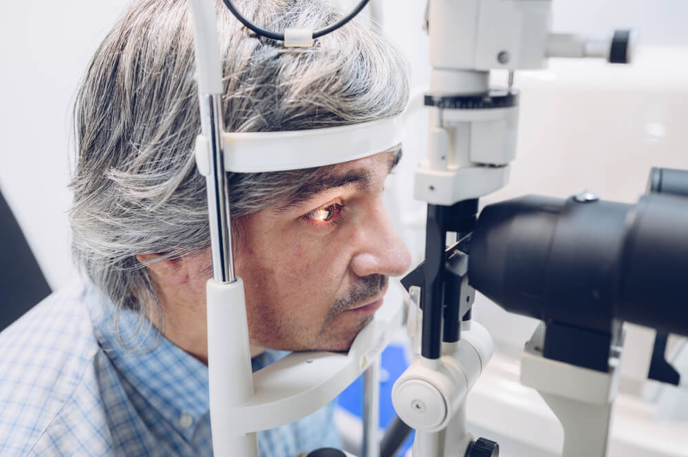 Man Taking Eyesight Test — Your Ophthalmologist in Townsville, QLD