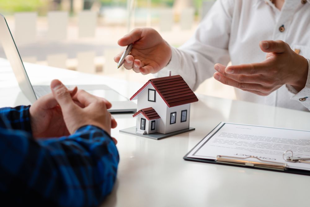 Insurance Agent and Client Discussing Home Insurance