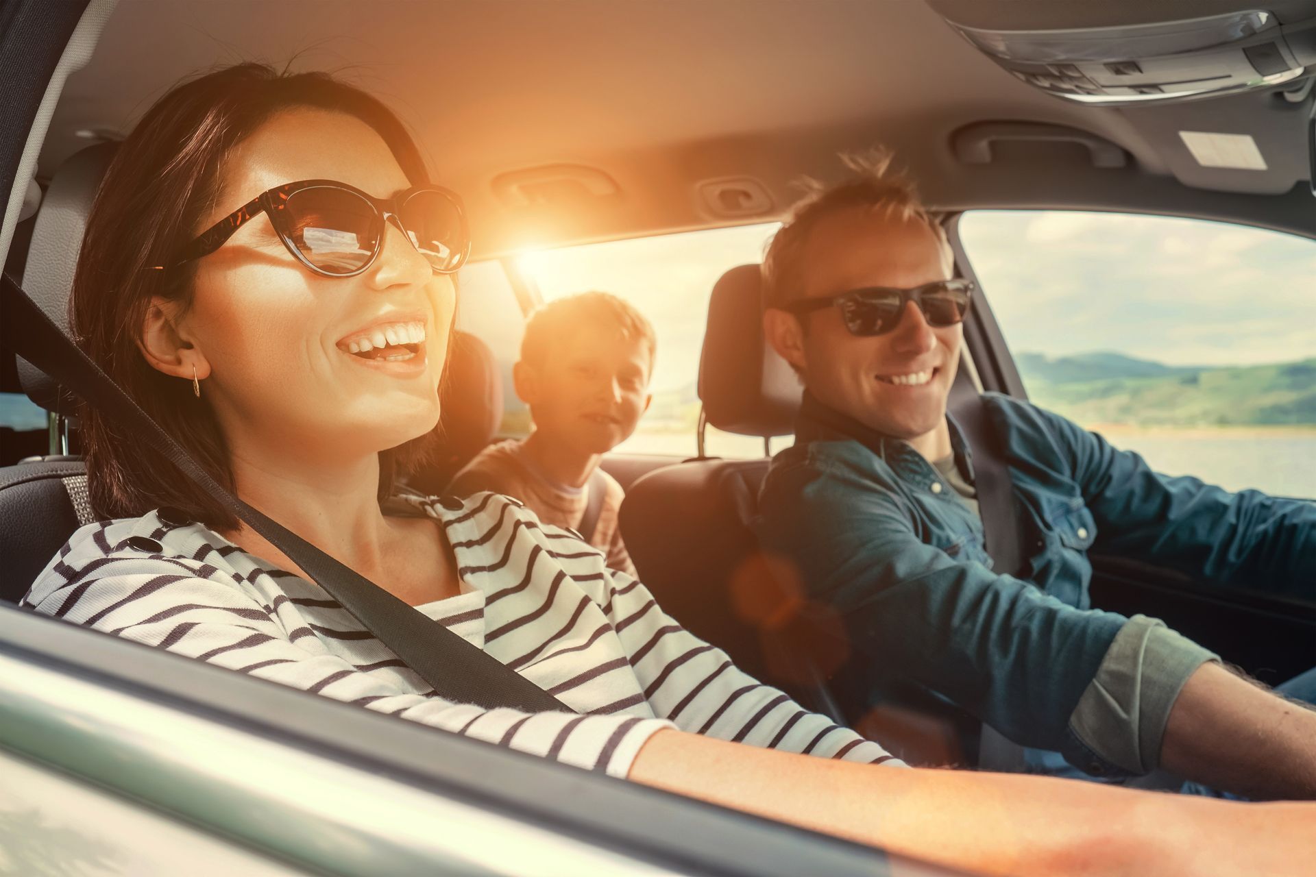 A family is riding in a car on a road trip.