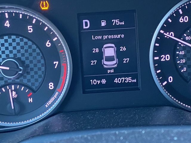 A close up of a car dashboard showing low pressure