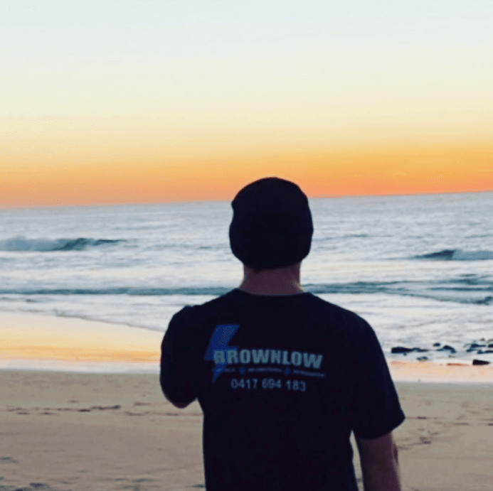 Handyman Installing Smoke Detector — Electricians In Fairy Meadow, NSW