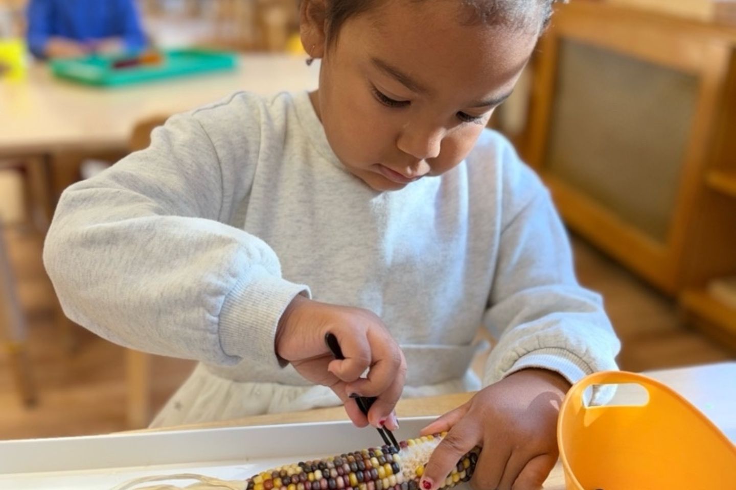 Montessori child exploring balancing routines with new experiences.