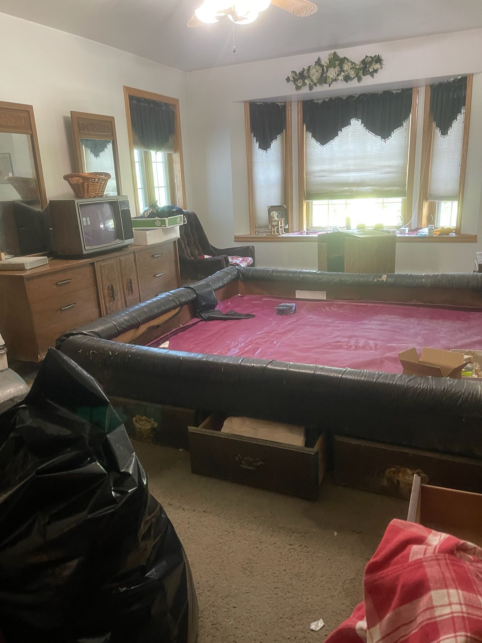 There is a pool table in the middle of the room.