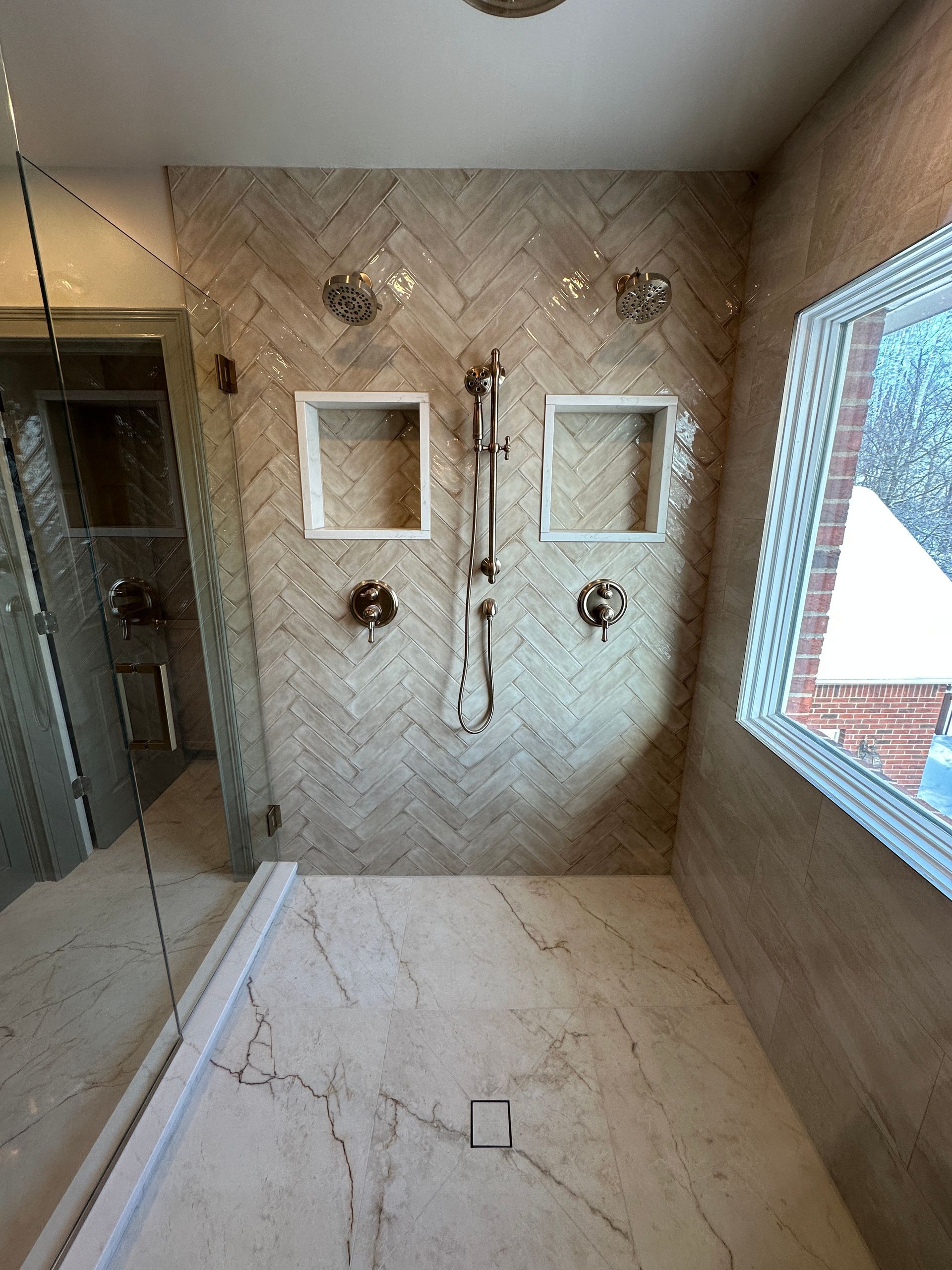 A bathroom with a toilet a sink and a mirror