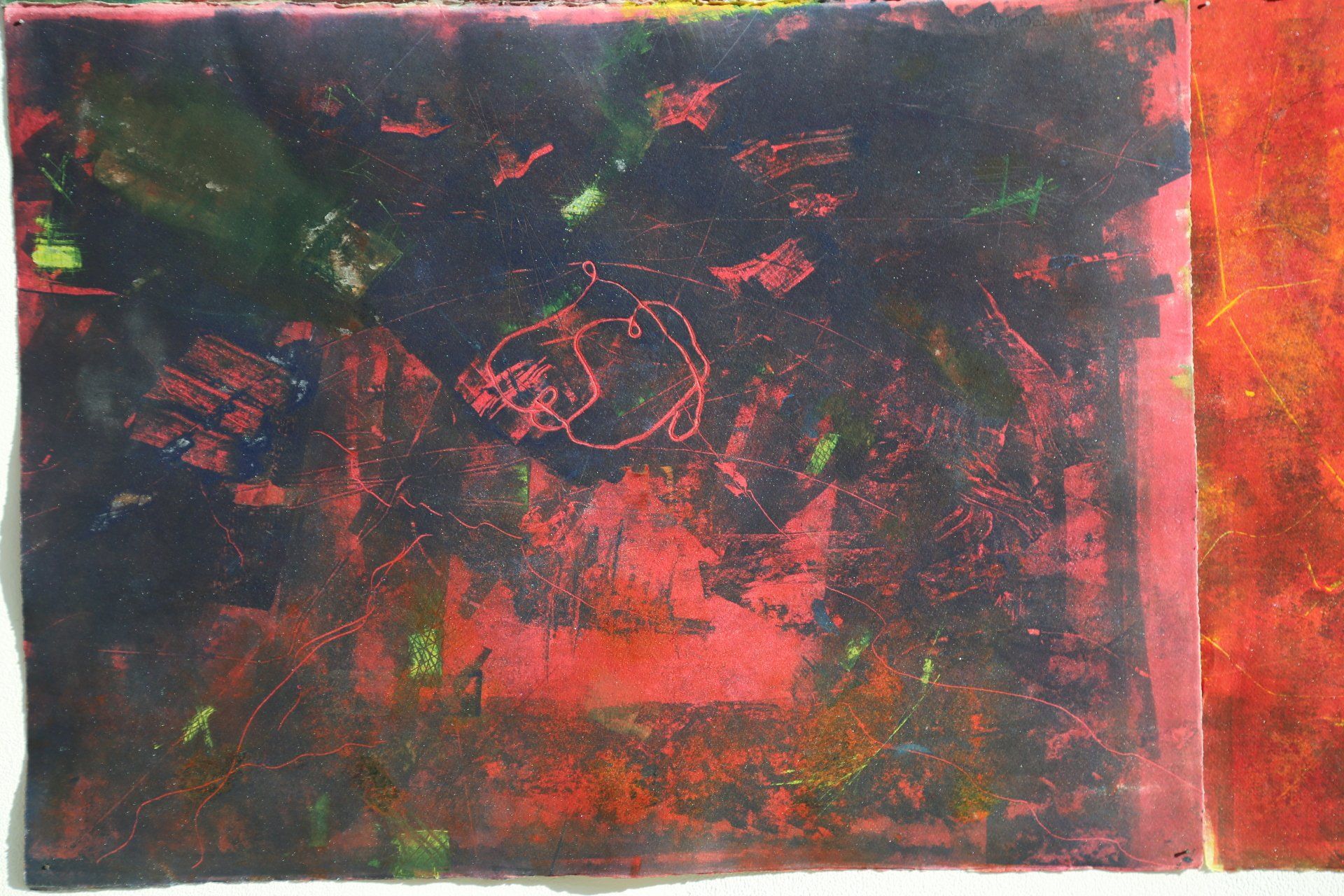 Abstract art piece. Dark red and black blended, with green and yellow highlights.