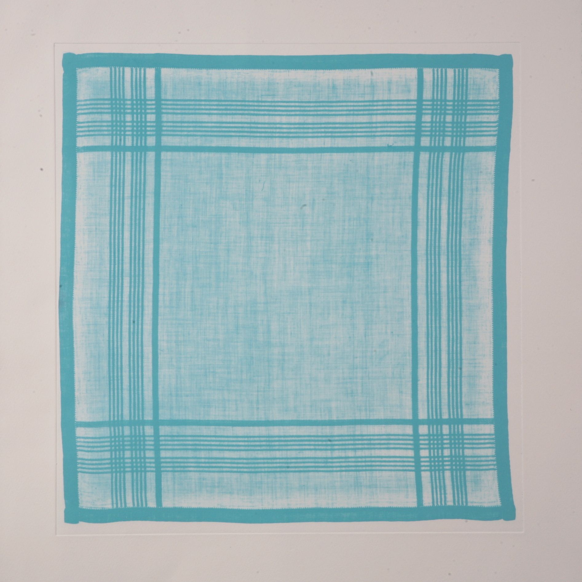 Blue handkerchief with turquoise borders and a simple plaid pattern.
