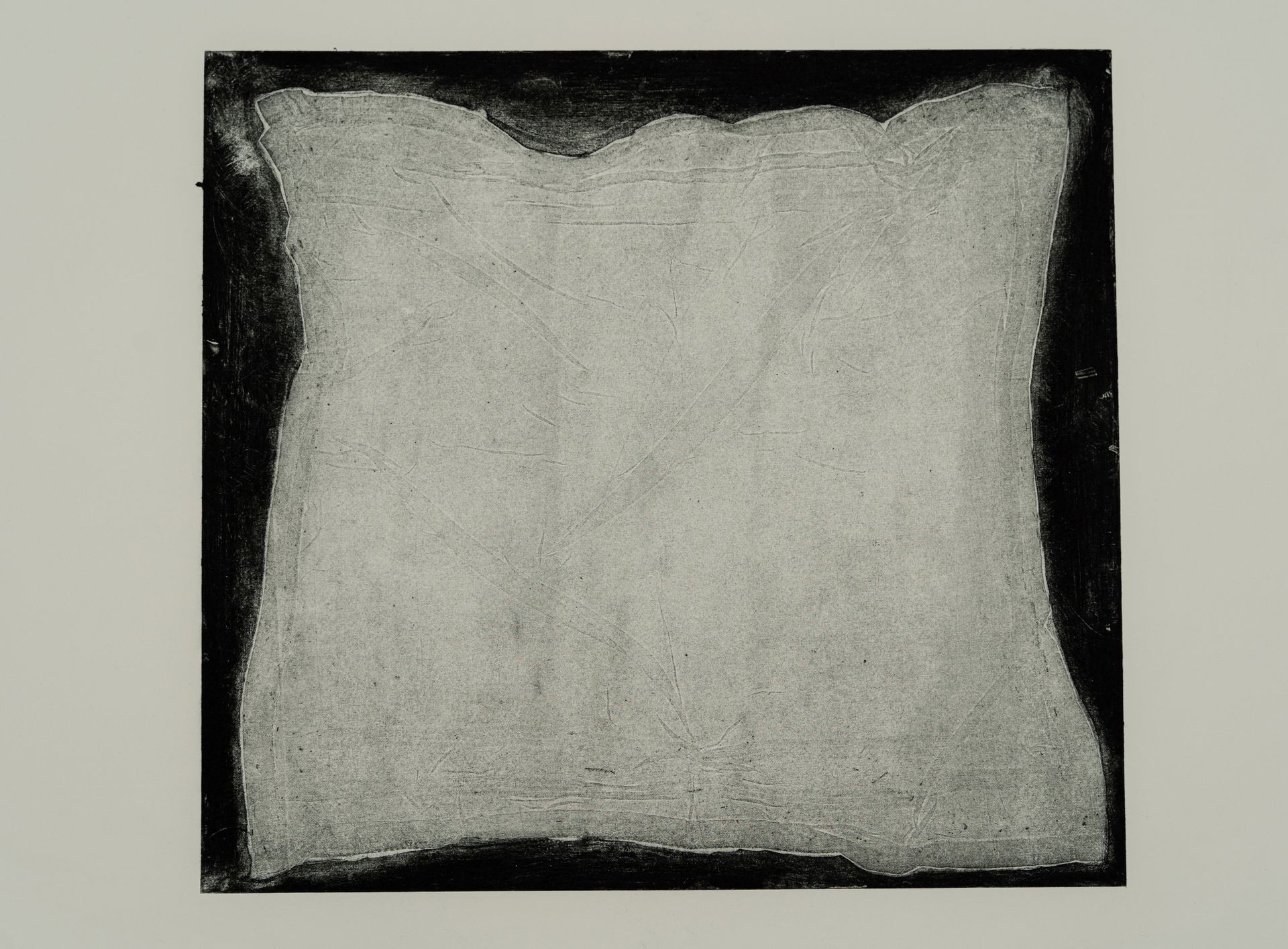 Square drawing of a light gray shape with a dark, textured border, centered on a white background.