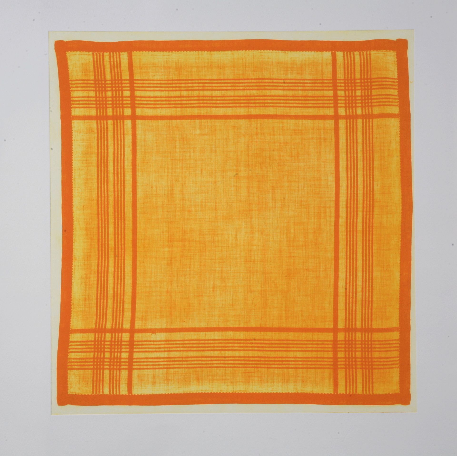 Orange square textile with orange border and cross-hatch lines on a light background.