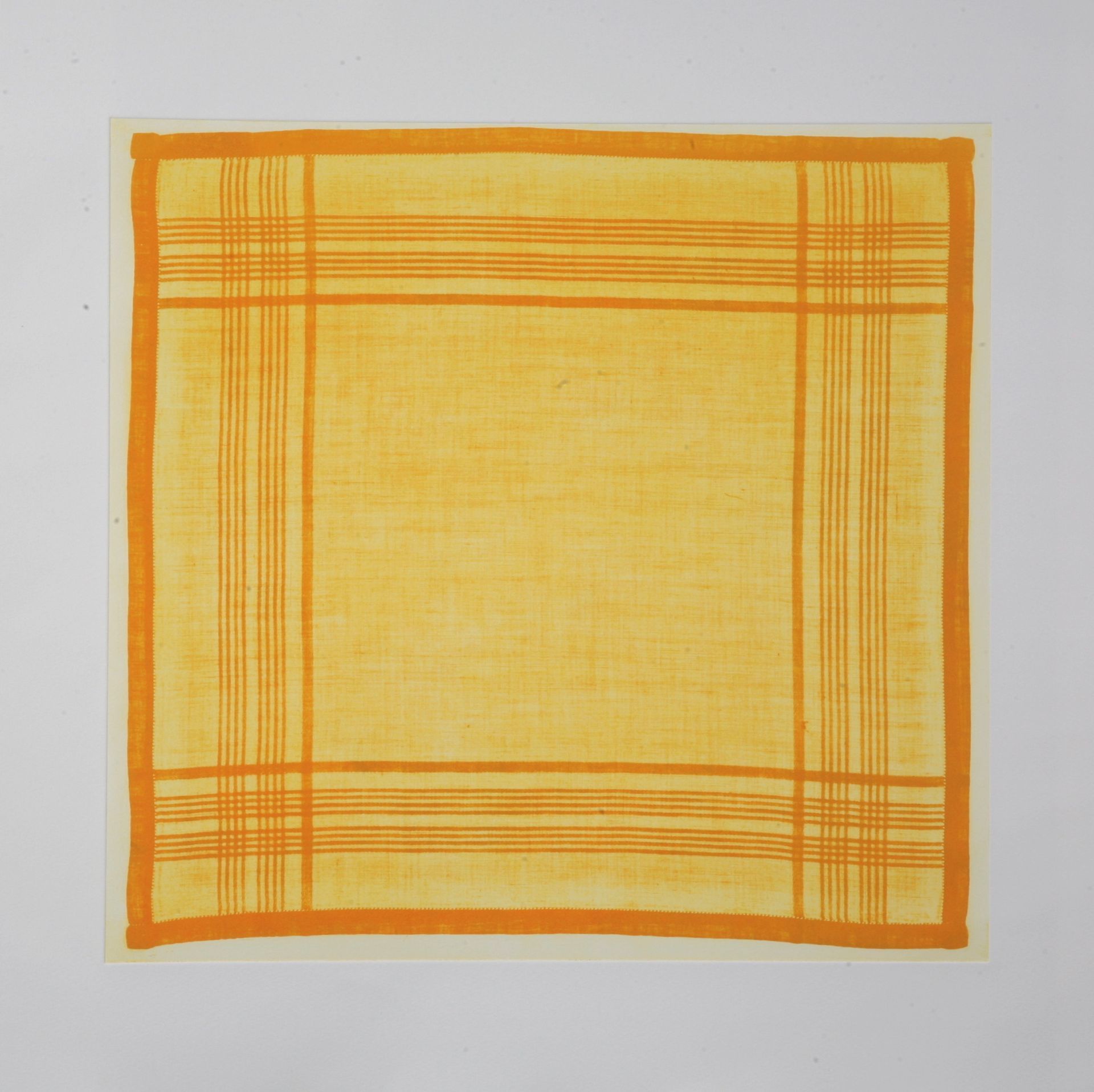 Yellow handkerchief with orange plaid border.