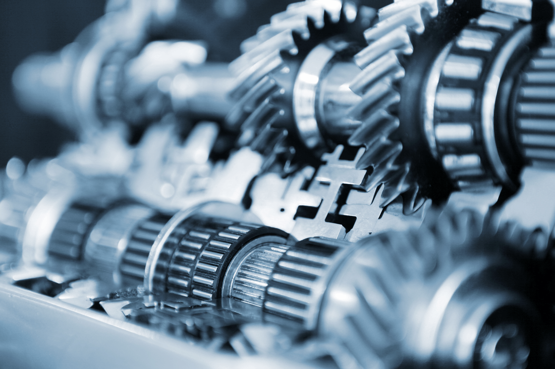 A close up of a machine with gears and bearings.