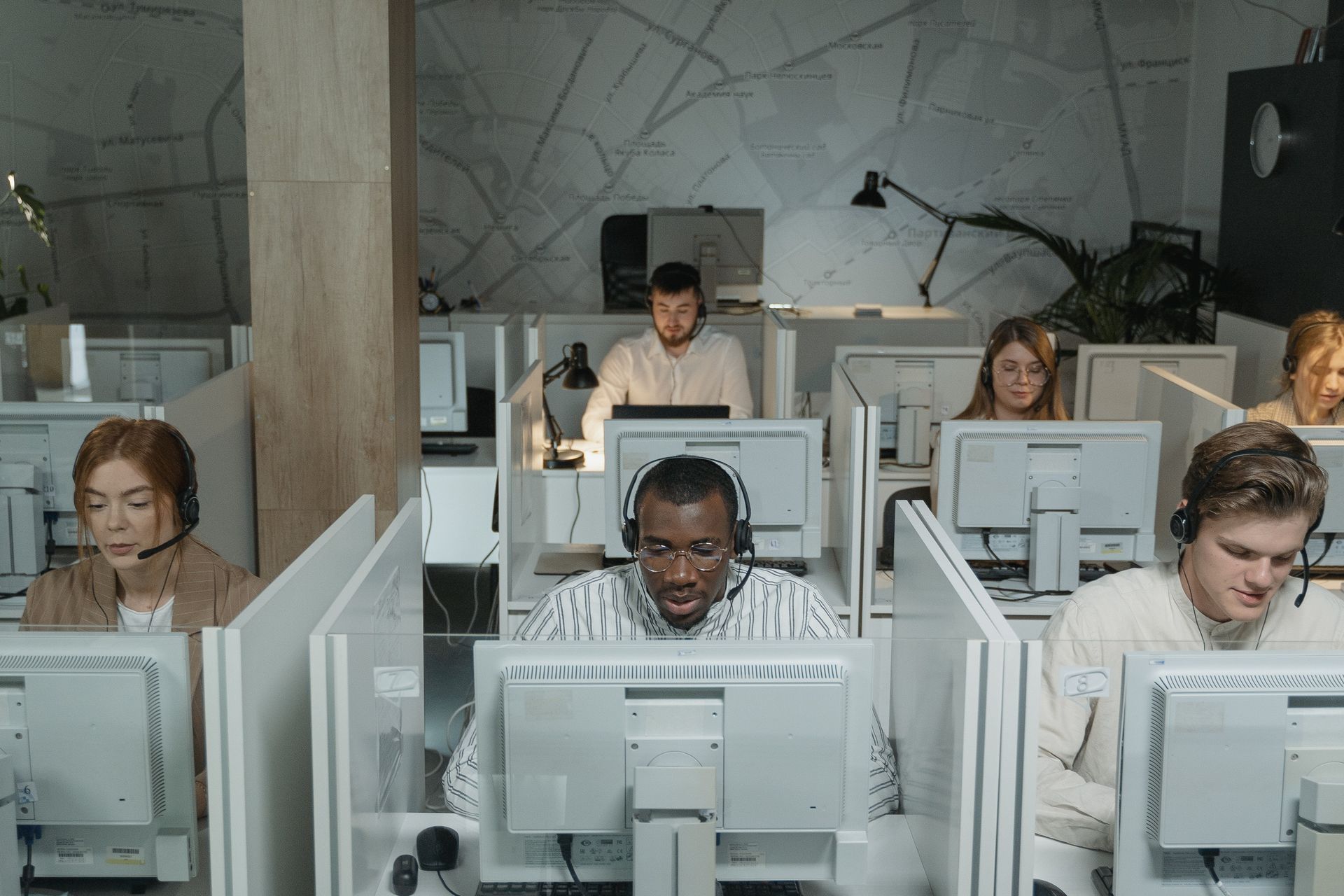 group of office workers in front of computers