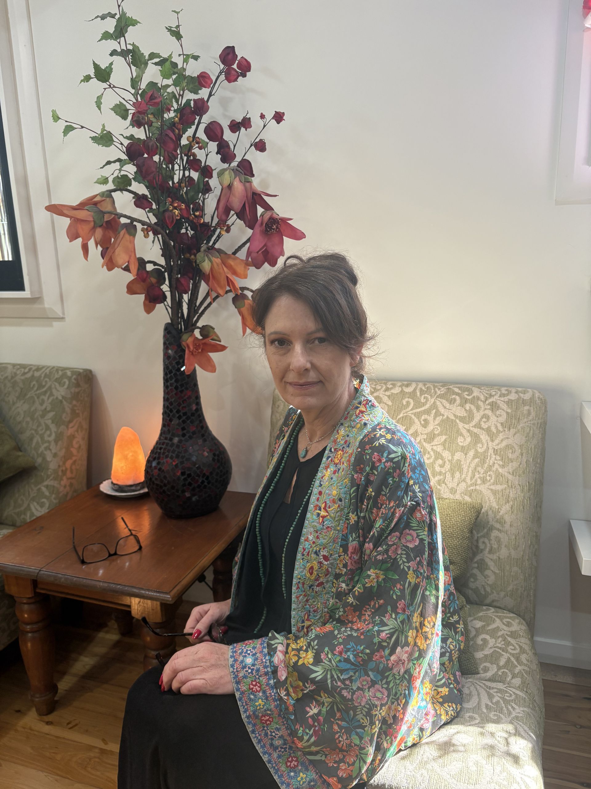 Man and Woman in Discussion at a Table With a Laptop; Light-filled Room — Mind Guidance Centre in Wangi Wangi, NSW