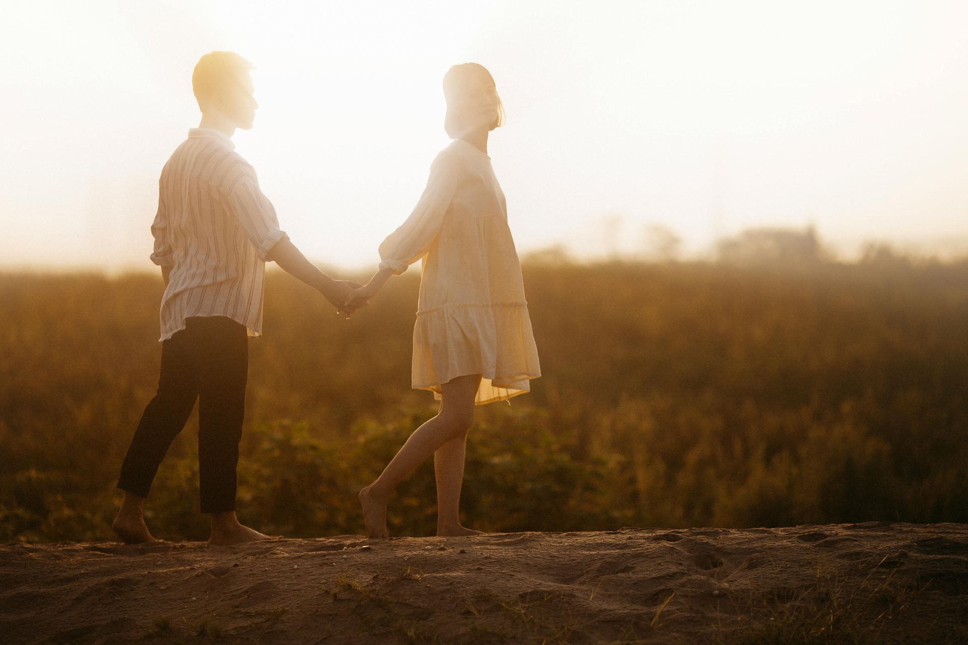 Couple Holding Hands During Therapy Session, With Therapist Taking Notes — Mind Guidance Centre in Wangi Wangi, NSW