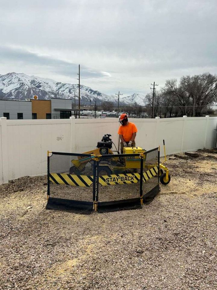 A person is working on a pipe with a wrench.