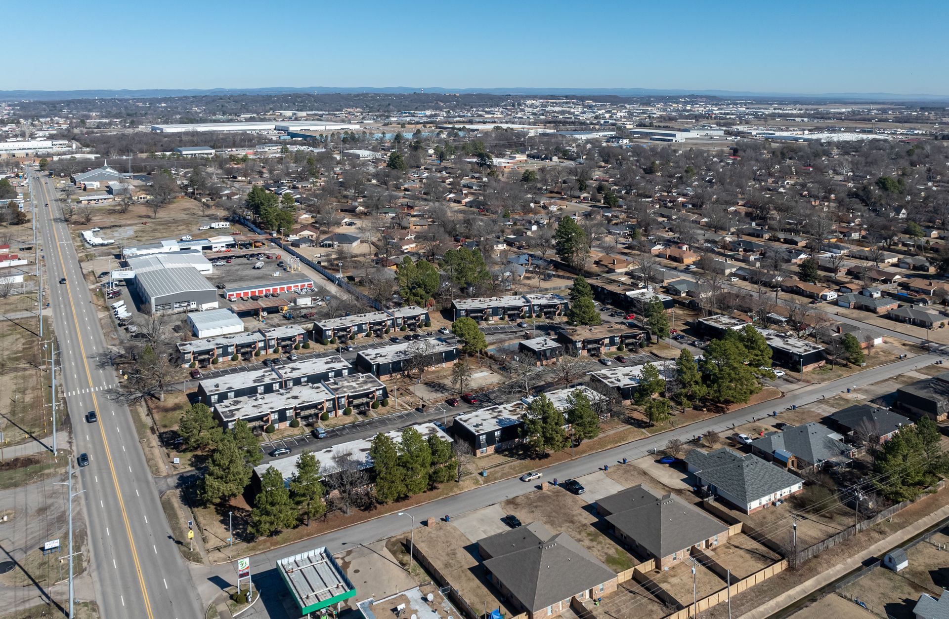 second angle of an aerial view of a residential area with a lot of houses and trees .