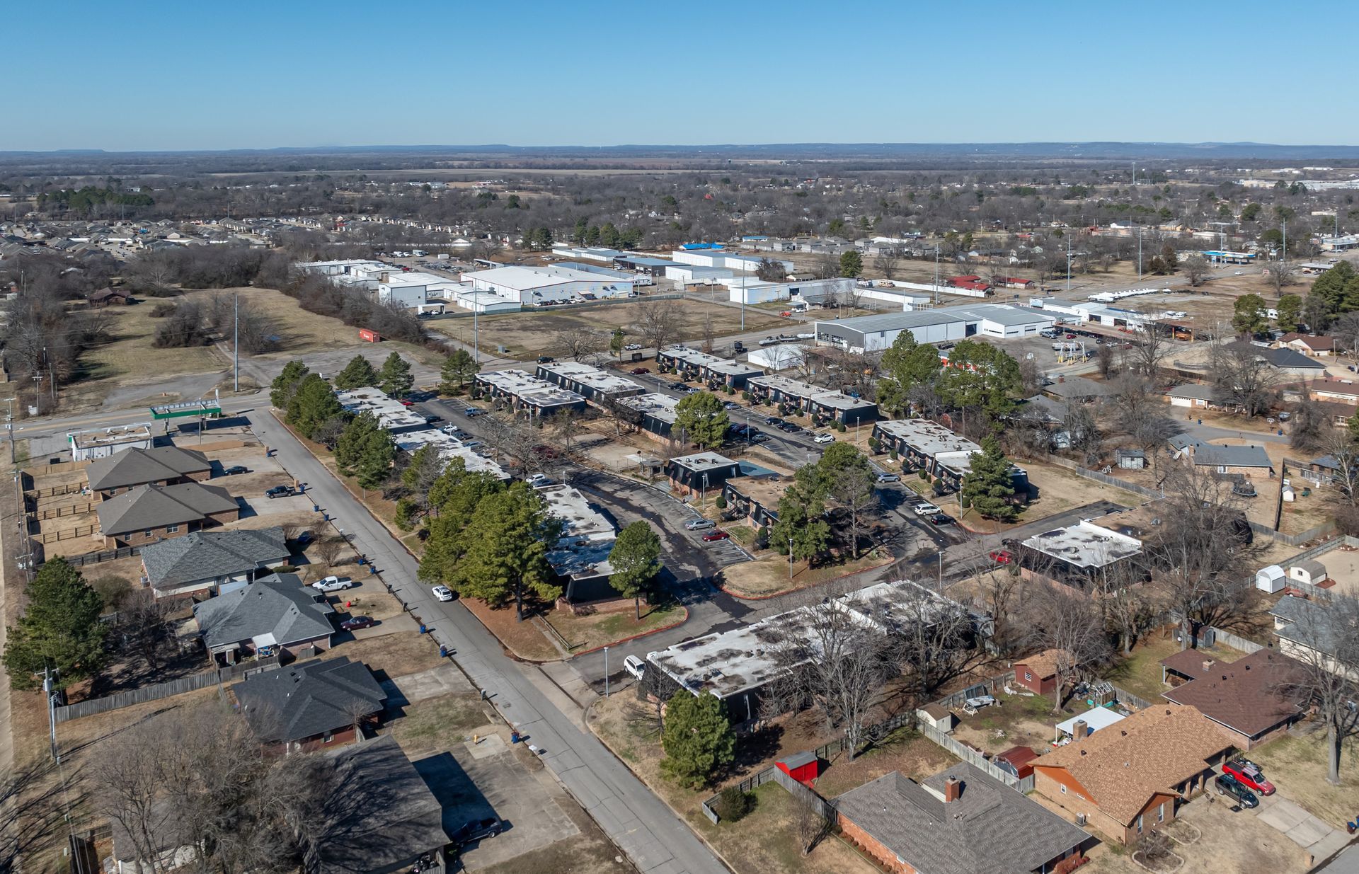an aerial view of a residential area with a lot of houses and trees .