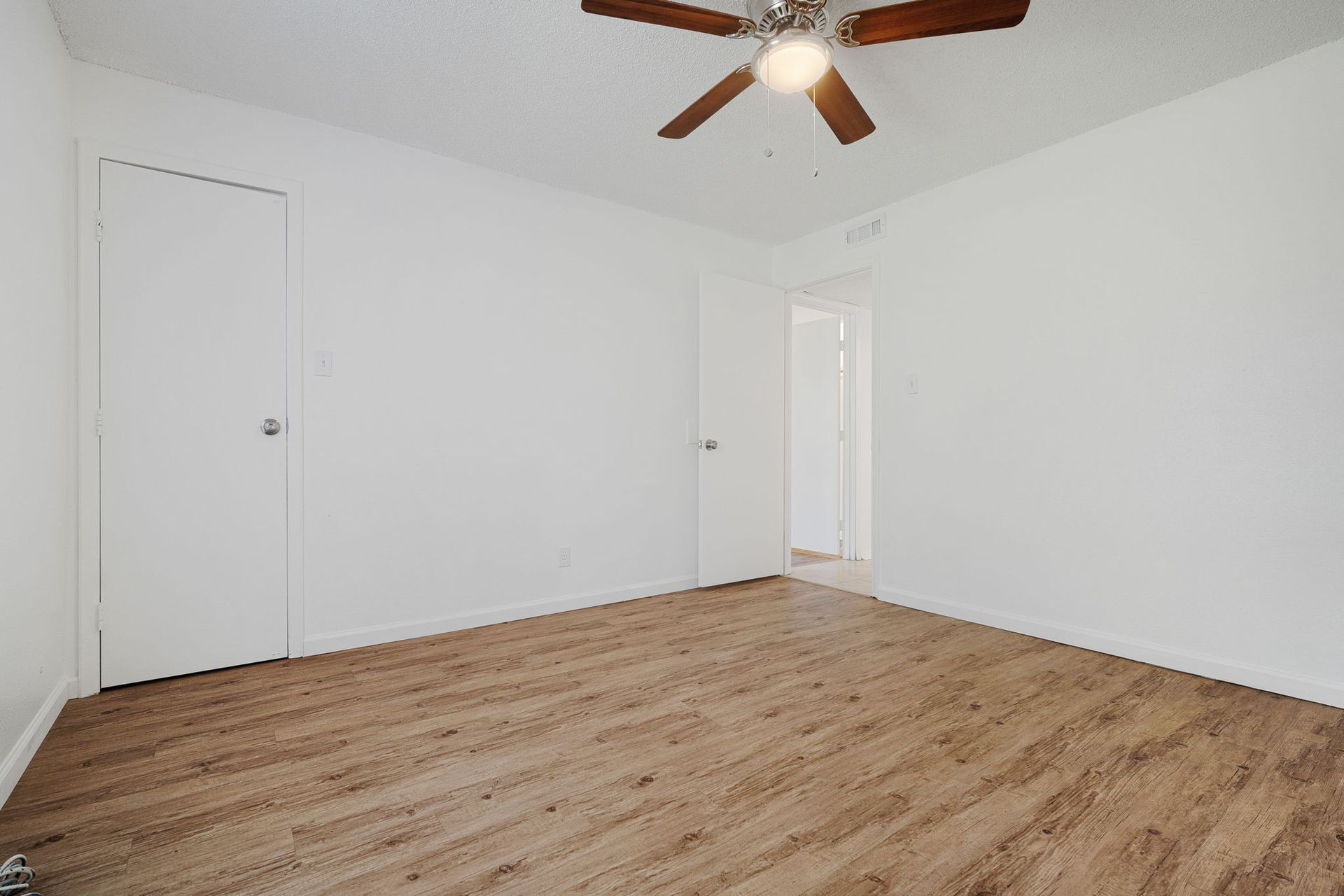 photo of a bedroom showing ceiling fan