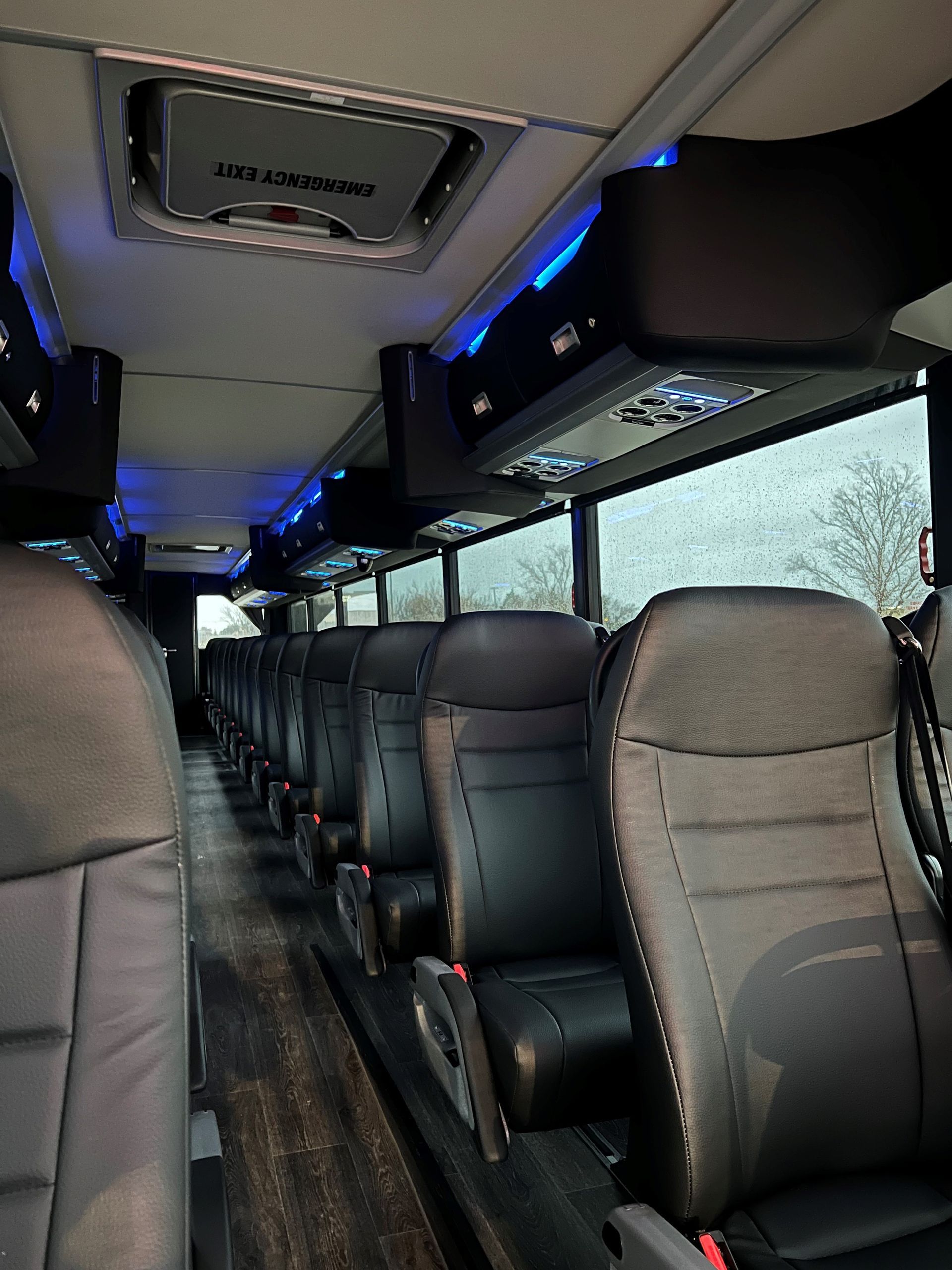 The inside of a bus with a lot of seats