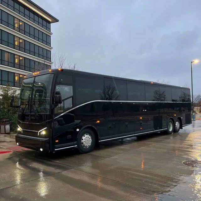 A white van is parked in a parking lot with the door open.McKinney TX blue ribbon limo