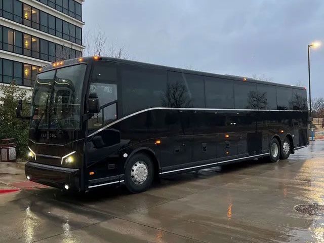A white van is parked in a parking lot with the door open.Frisco TX Wedding limo service blue ribbon limo