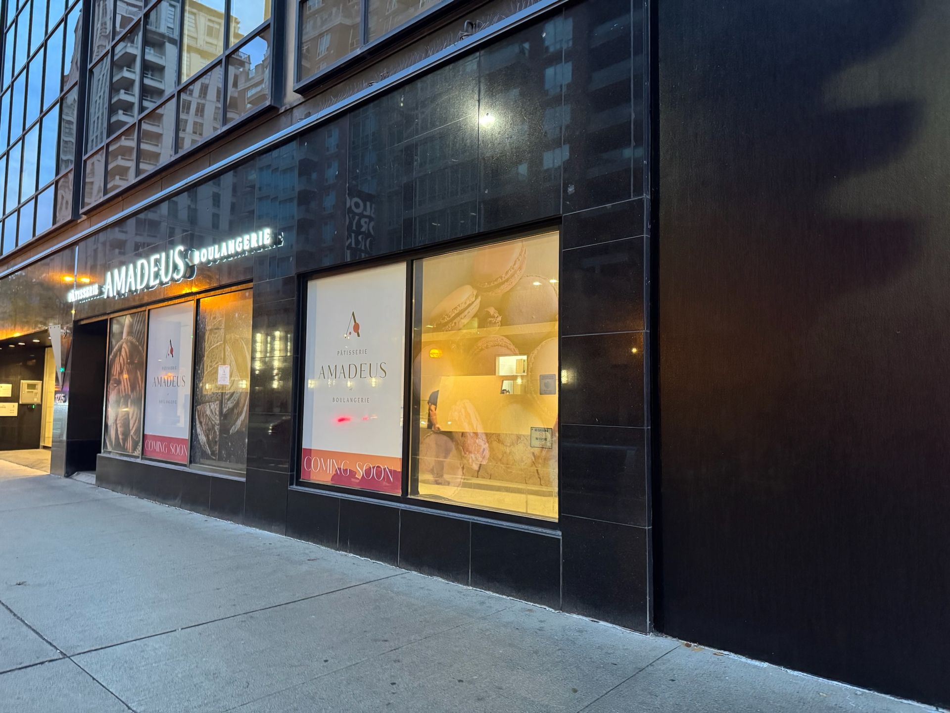 A storefront with a black facade and the name 