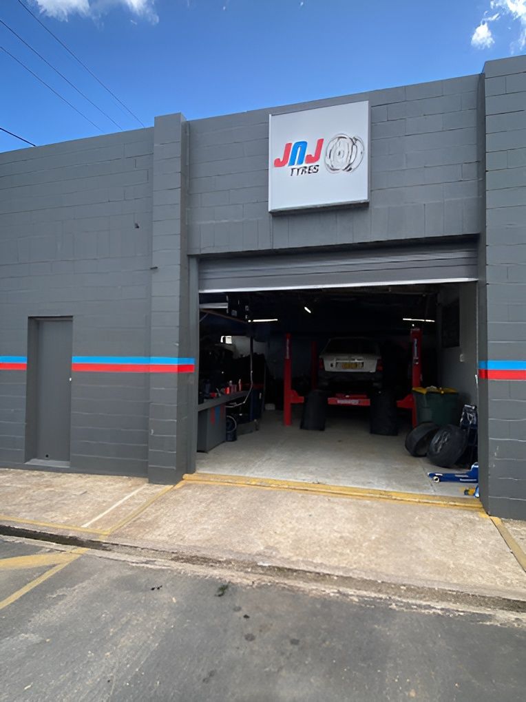 A Grey Building with An Open Garage Door — Jakes Tyres in South Murwillumbah, NSW
