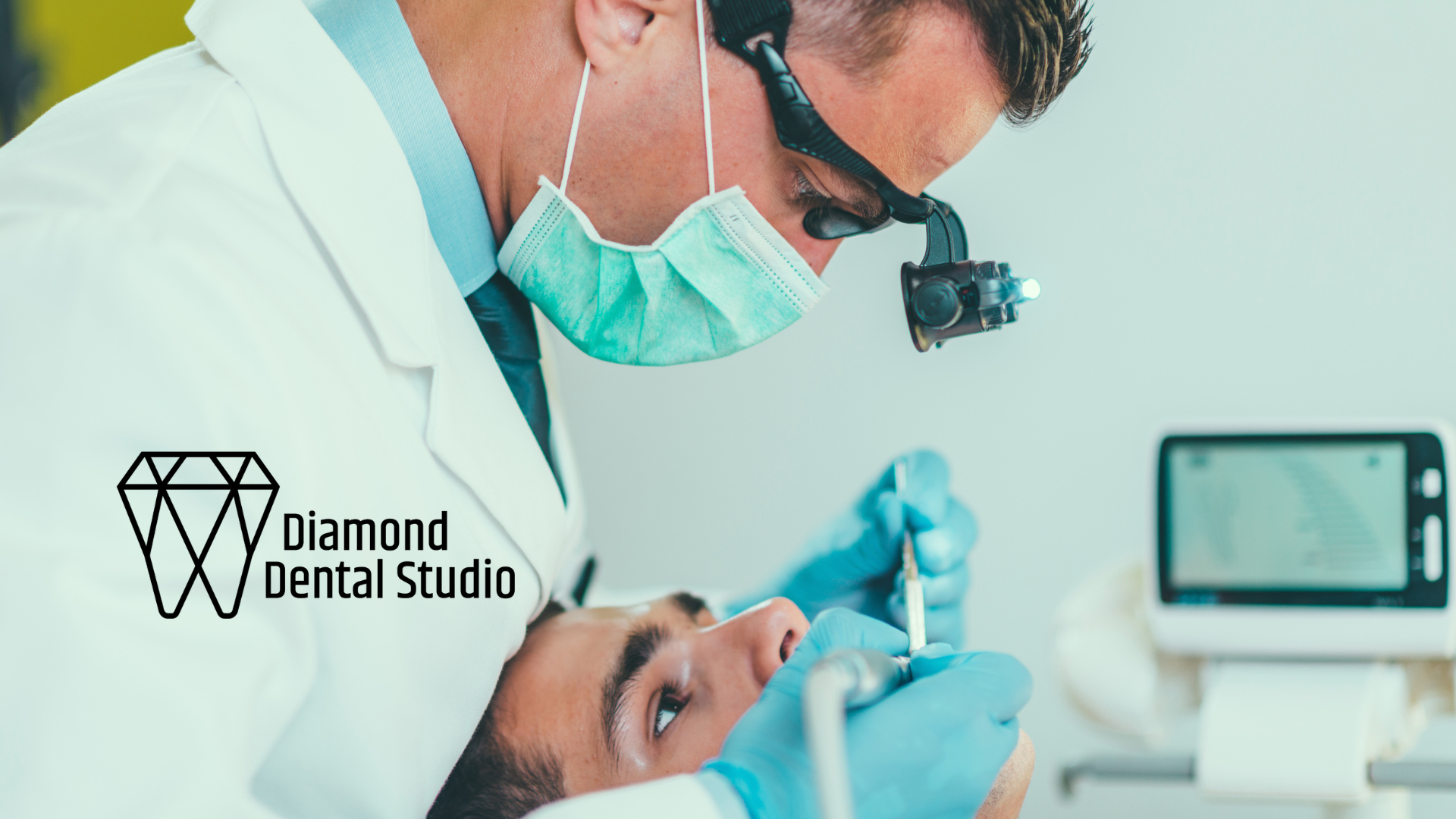 Dentist examining a patient's mouth with tools in a dental studio.