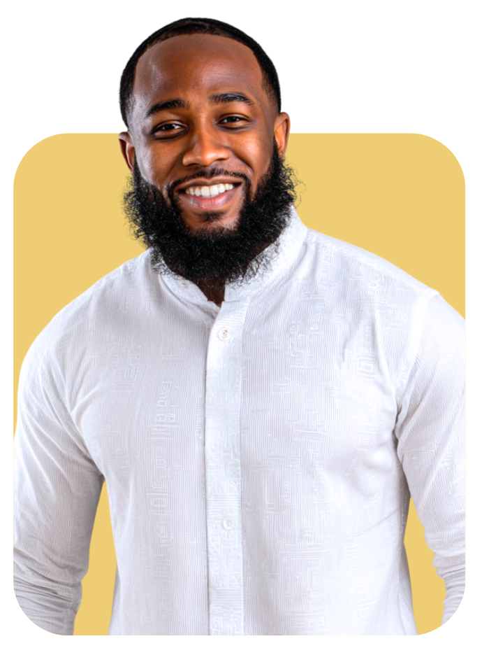 Man with a beard smiles, wearing a white shirt against a yellow background.