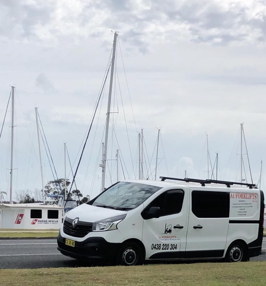 White Van With Company Logo Parked in Front of Sailboats — A1 Forklifts In South West Rocks, NSW