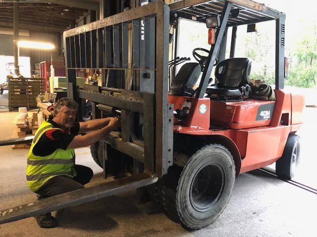Man in Vest Working on Forklift, Outdoors — A1 Forklifts In Macksville, NSW