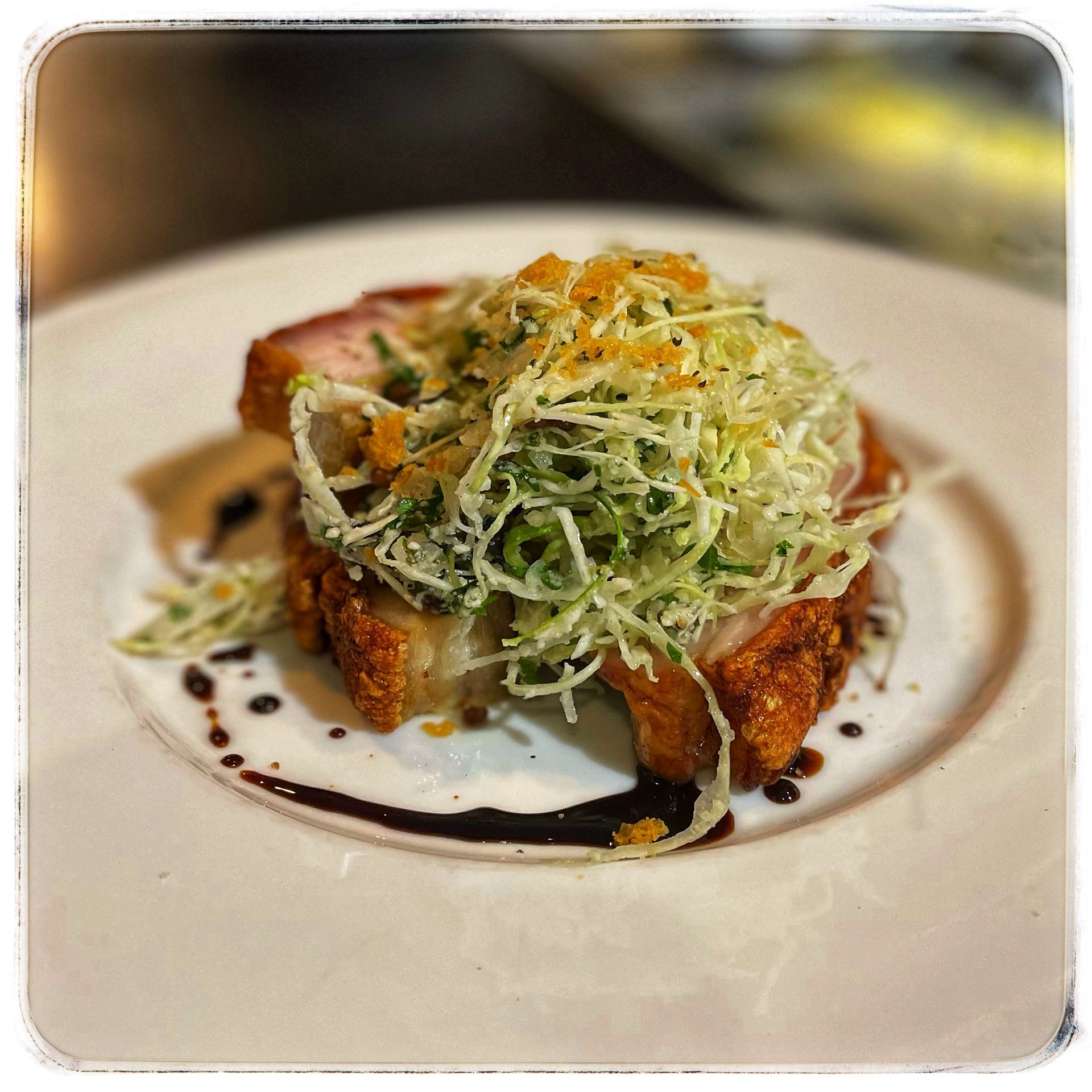 Meat and salad on a white plate — Onesta Cucina in Bowral, NSW