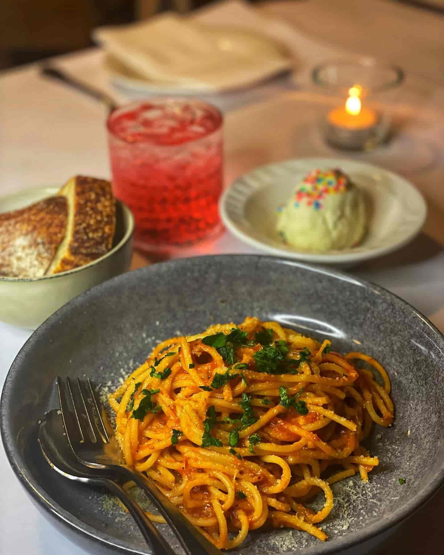 A Bowl of Spaghetti With a Fork on a Table — Onesta Cucina in Bowral, NSW