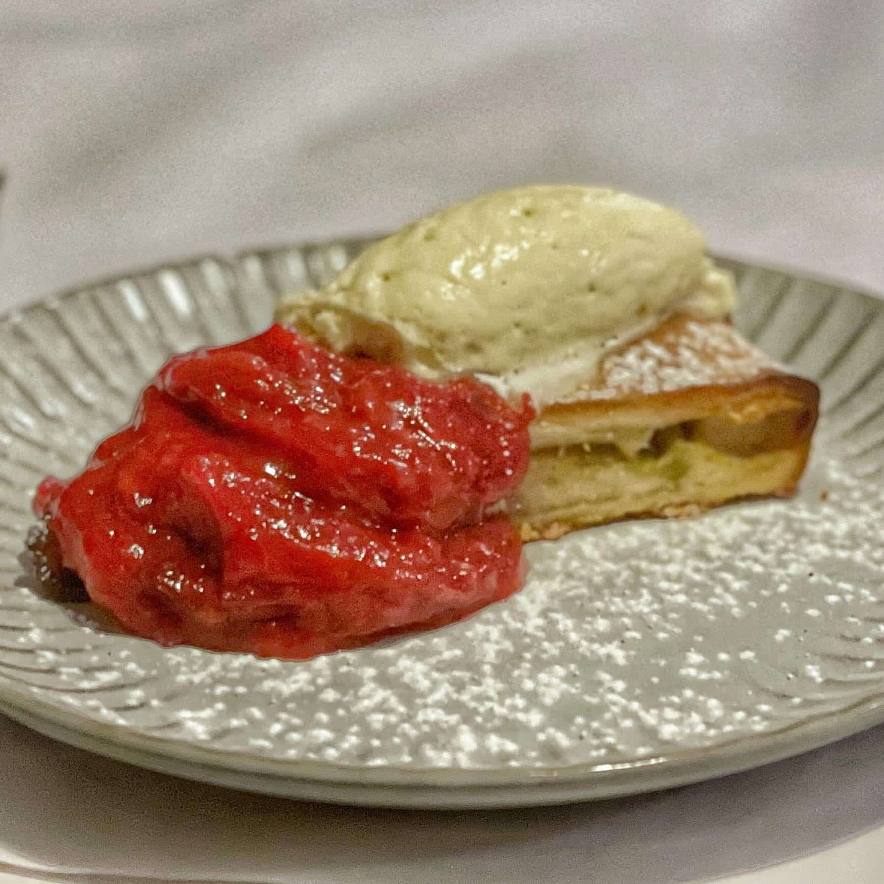 A Plate of Food With Ice Cream and Strawberry Sauce — Onesta Cucina in Bowral, NSW