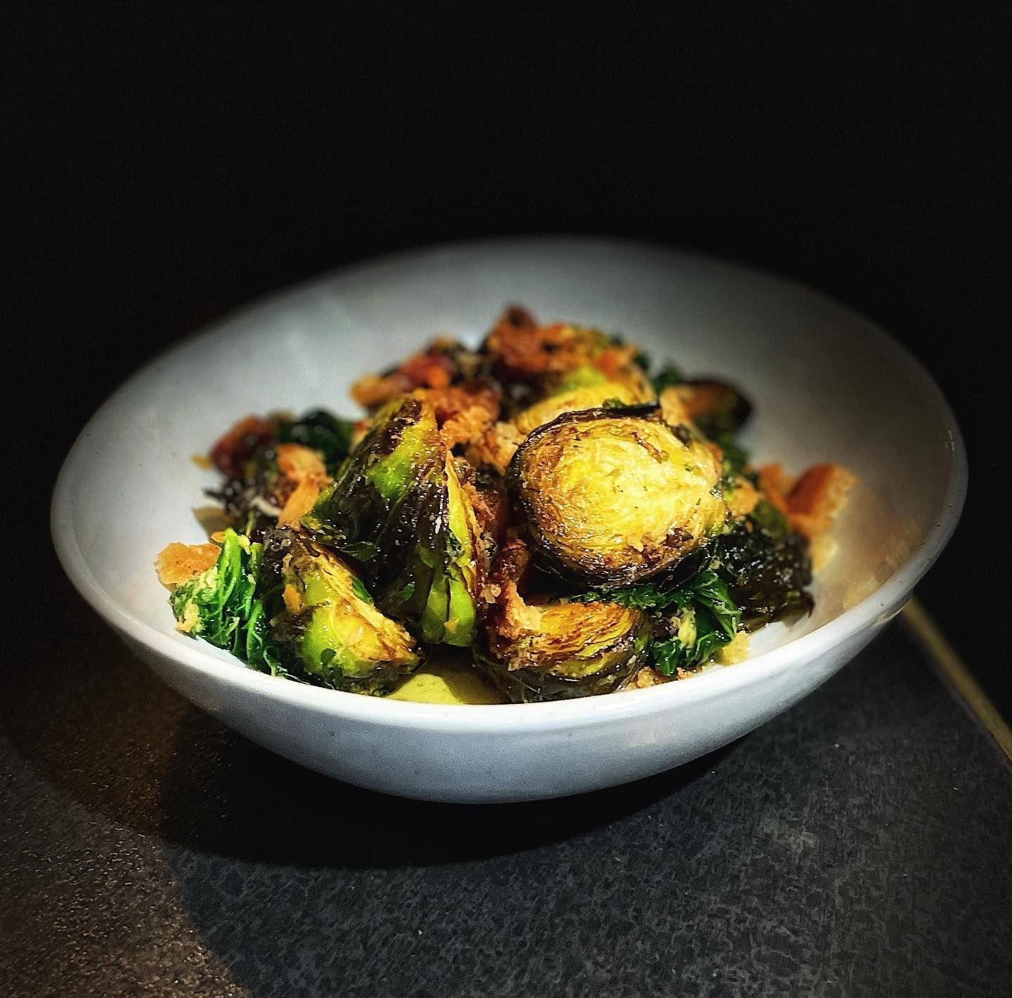 A White Bowl Filled With Vegetables on a Table — Onesta Cucina in Bowral, NSW