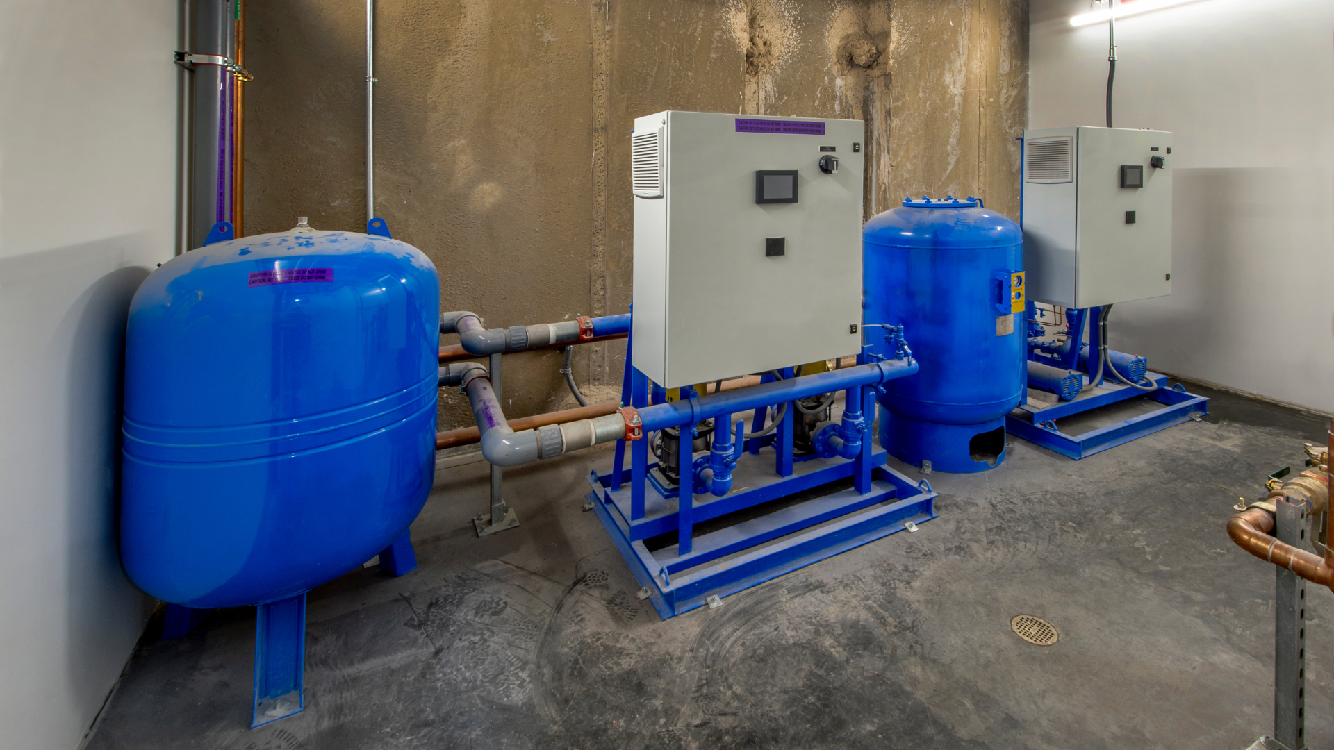 A room with a lot of blue tanks and boxes.