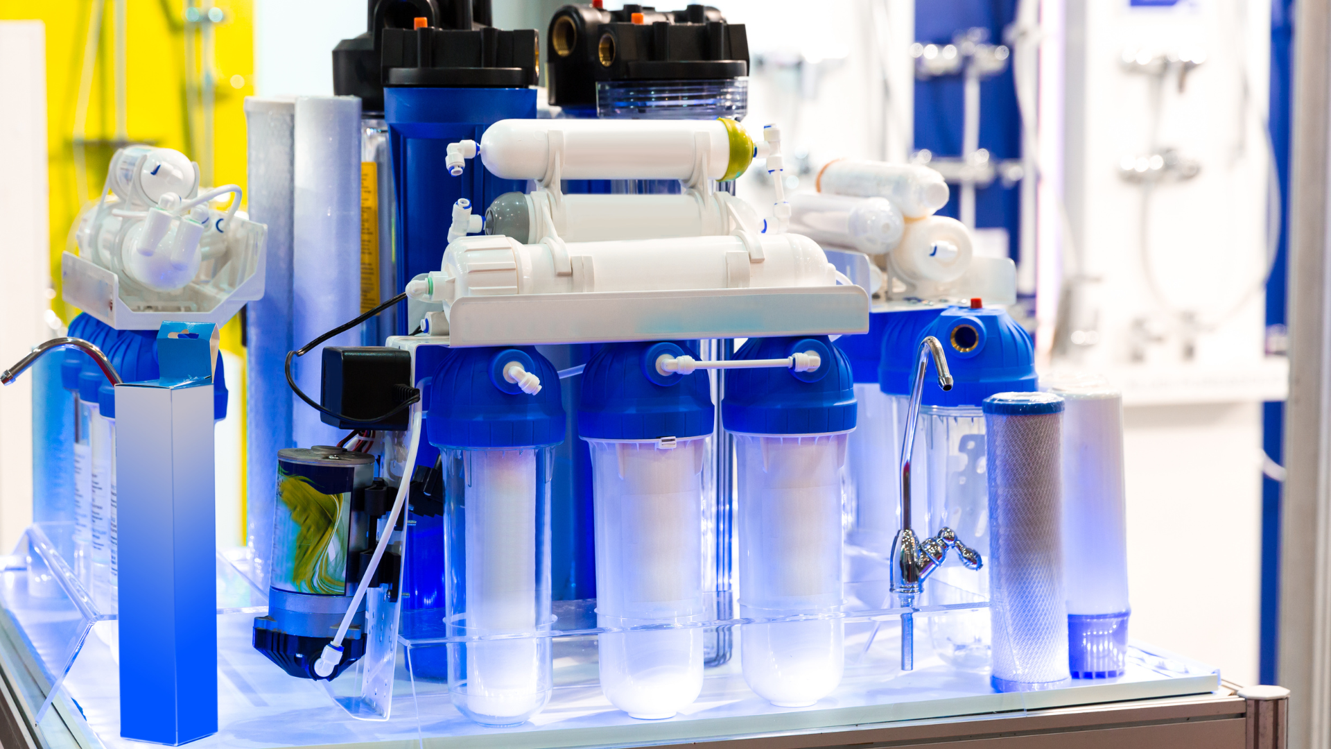 A group of water filters are sitting on top of a table.