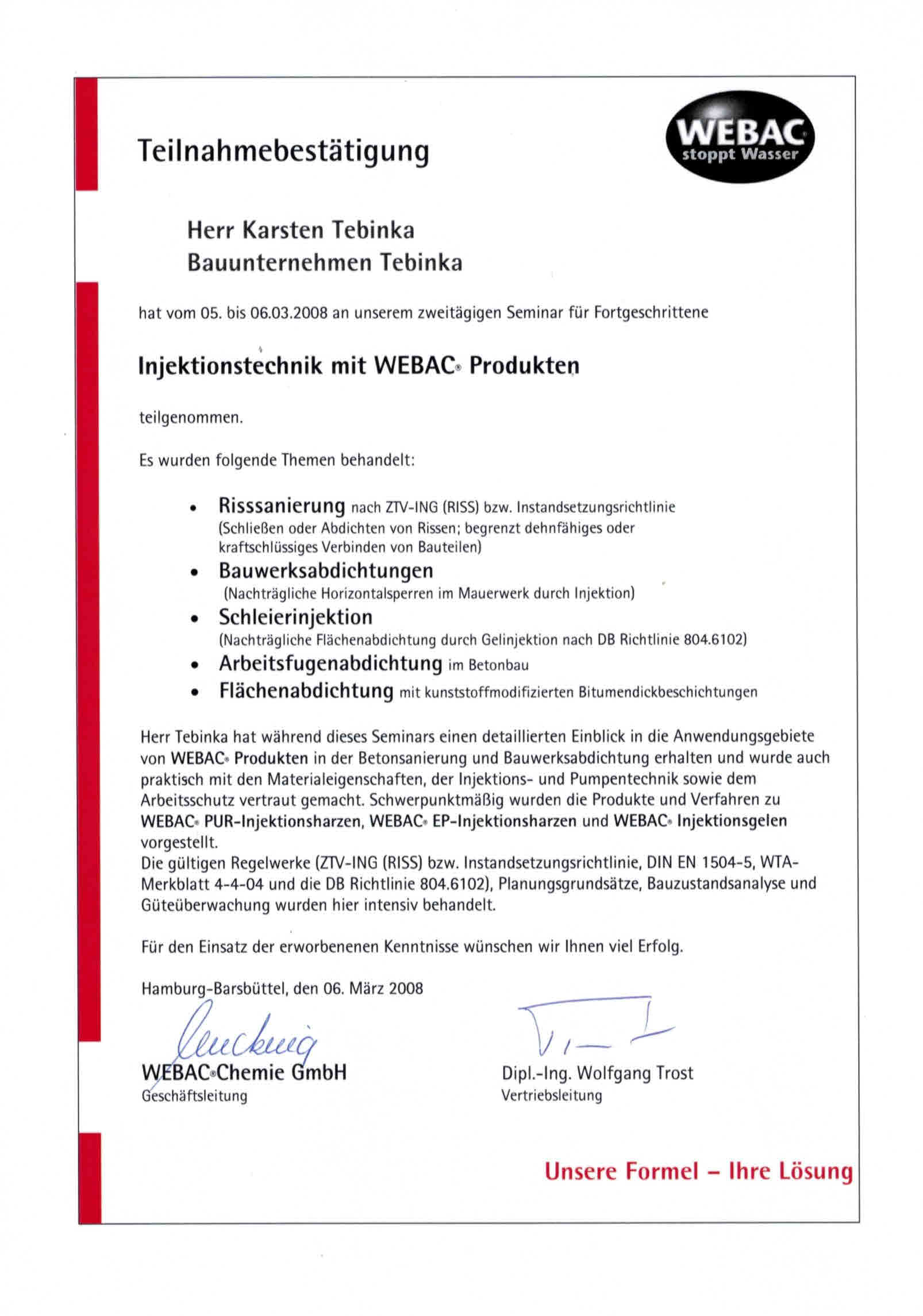 Eine weiß-rote Urkunde mit einer Unterschrift darauf.