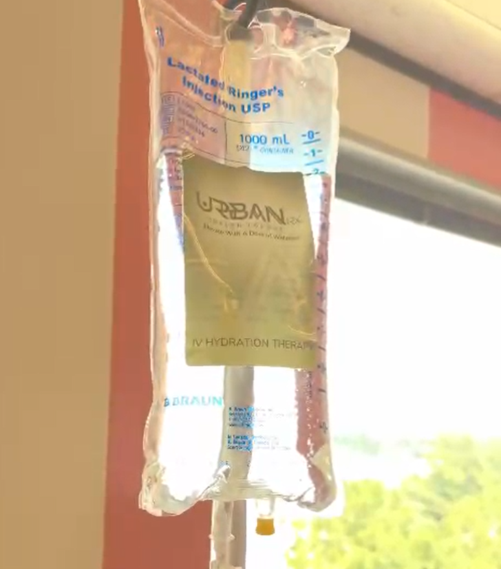 A bag of liquid iv bag with a label that says urbanrx health lounge mobile iv services in houston, tx