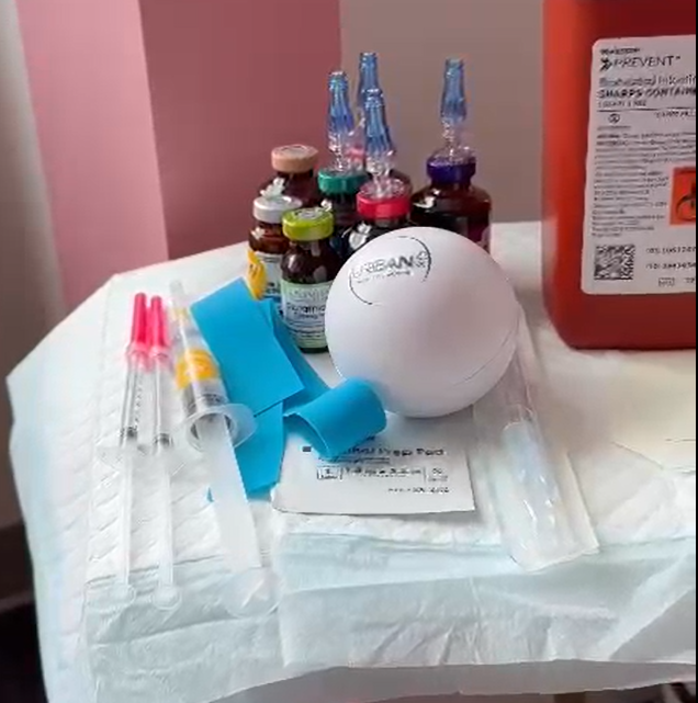 A table with Urbanrx  IV Shots Ads' on it 