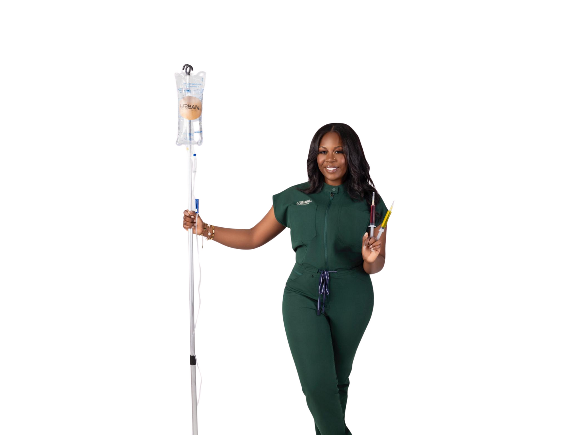 A woman in a green scrub suit is holding an iv bag from urbanrx helath lounge in houston, tx