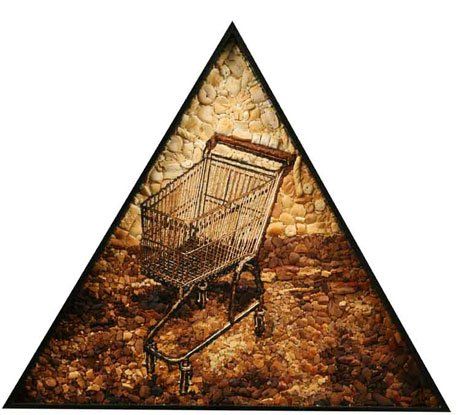 A picture of a shopping cart in a triangle