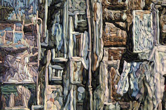 A close up of a painting of a building with a lot of windows.