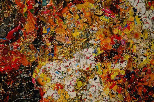 A close up of a colorful painting on a wall.